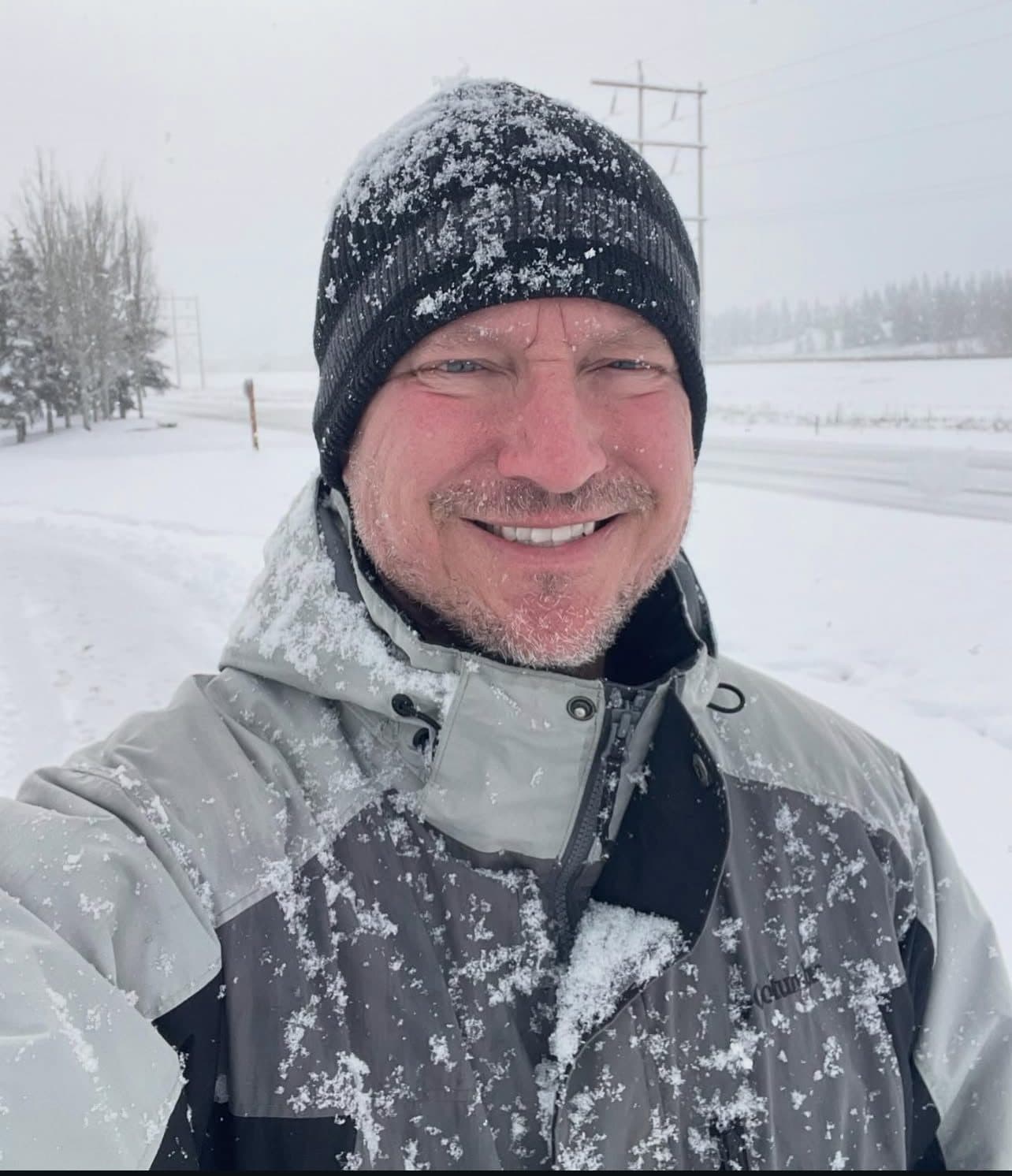 Kyle Dowdeswell, owner of Rocky Mountain Home Inspections, outside on a snowy day